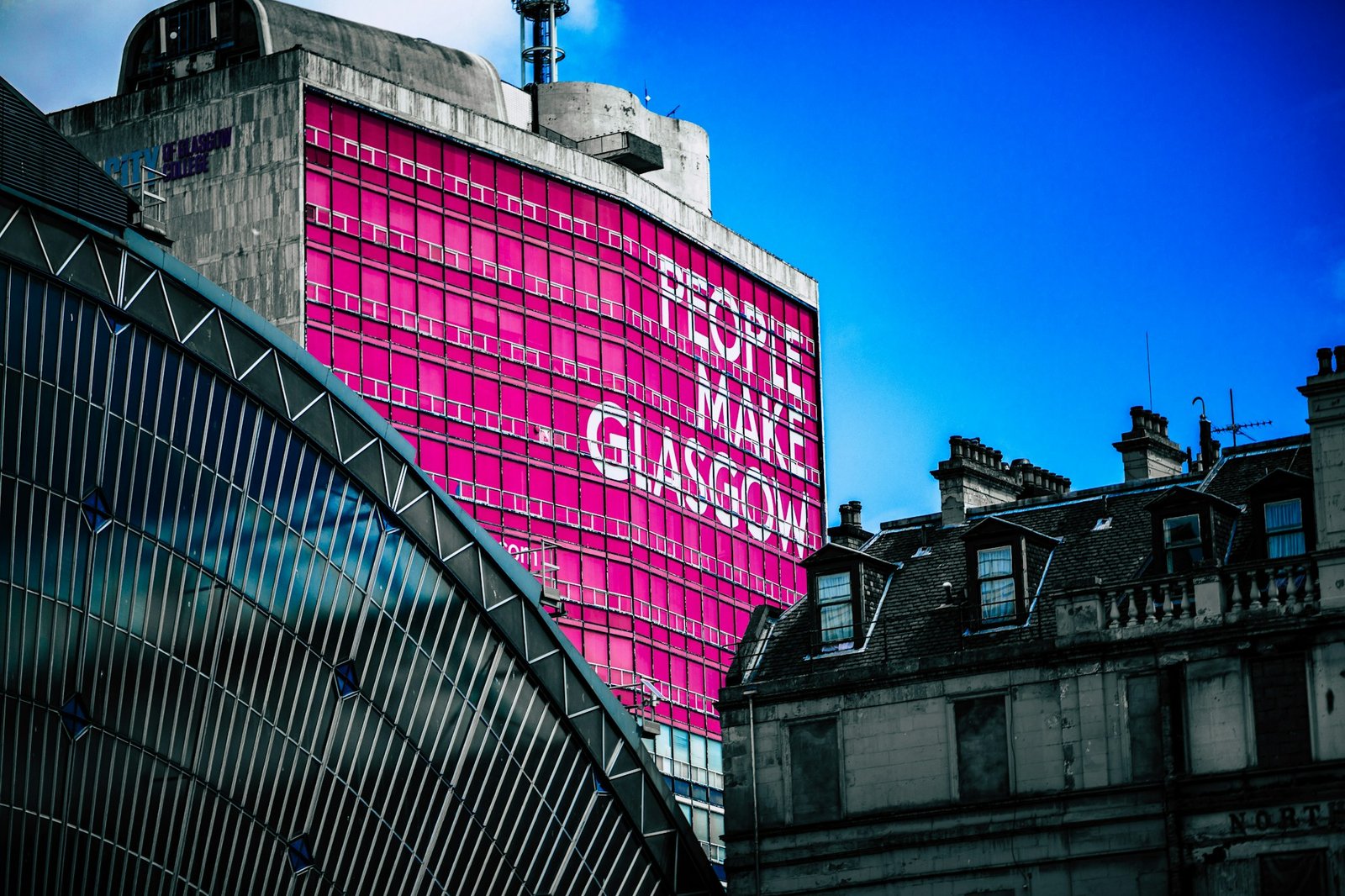 Glasgow city building with the "People Make Glasgow" billboard