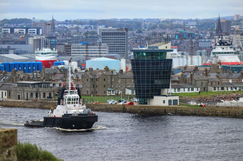 Aberdeen Harbour with a boat and city buildings